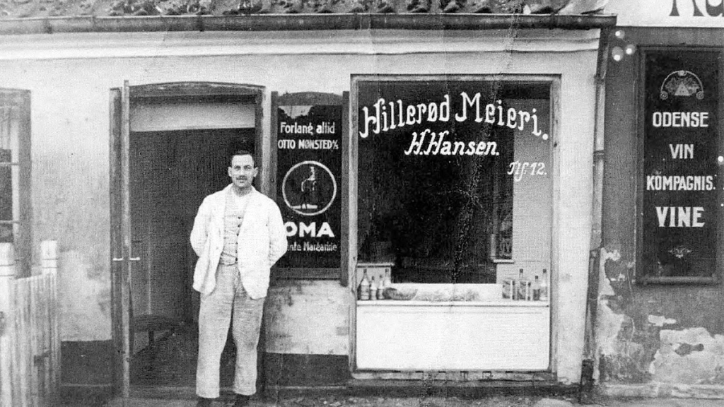 Hansen Mejeri man in front of shop