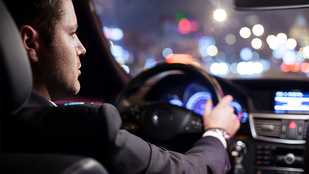 Hertz car rental - Man driving a car at night