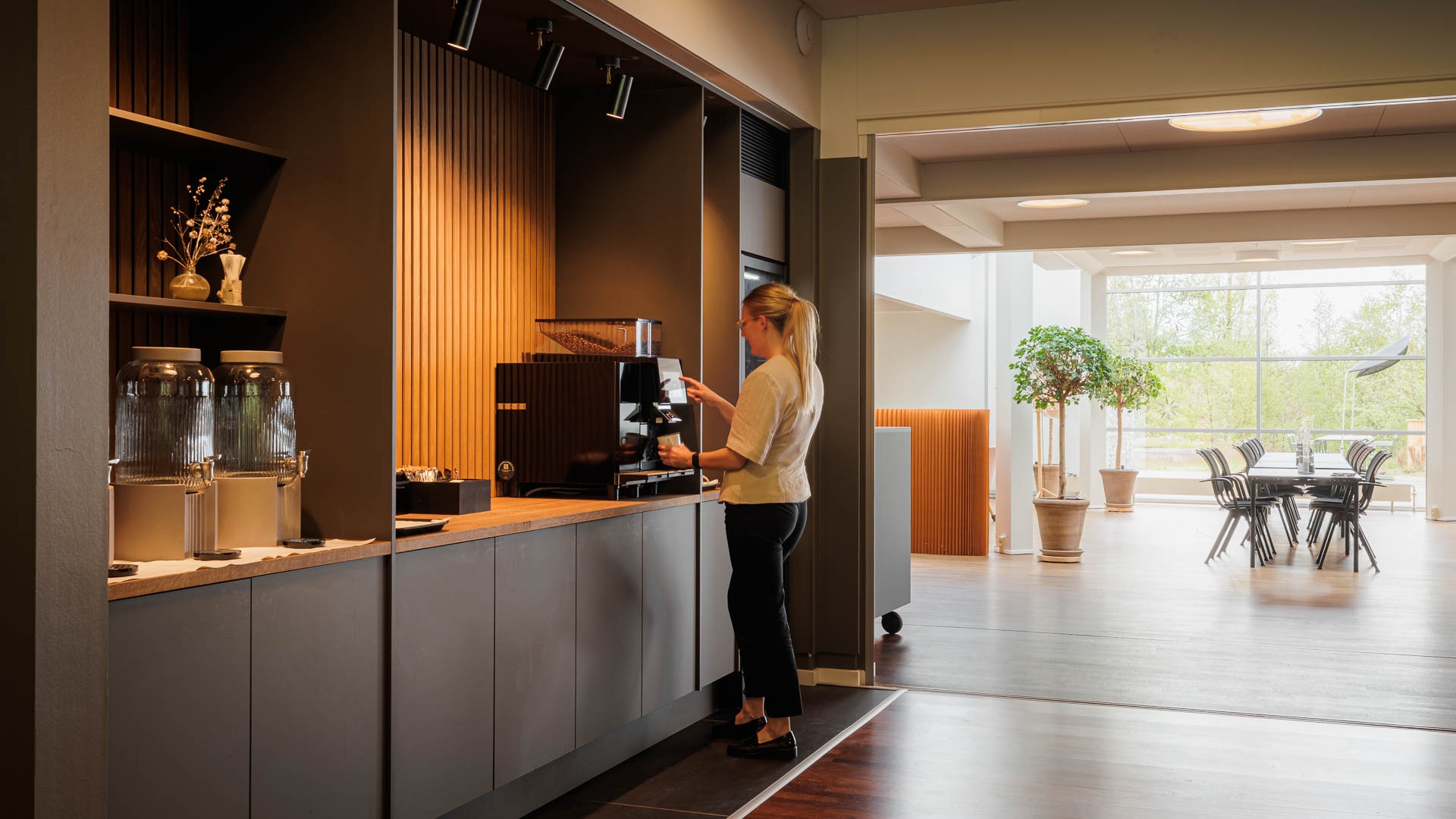 At the coffee machine