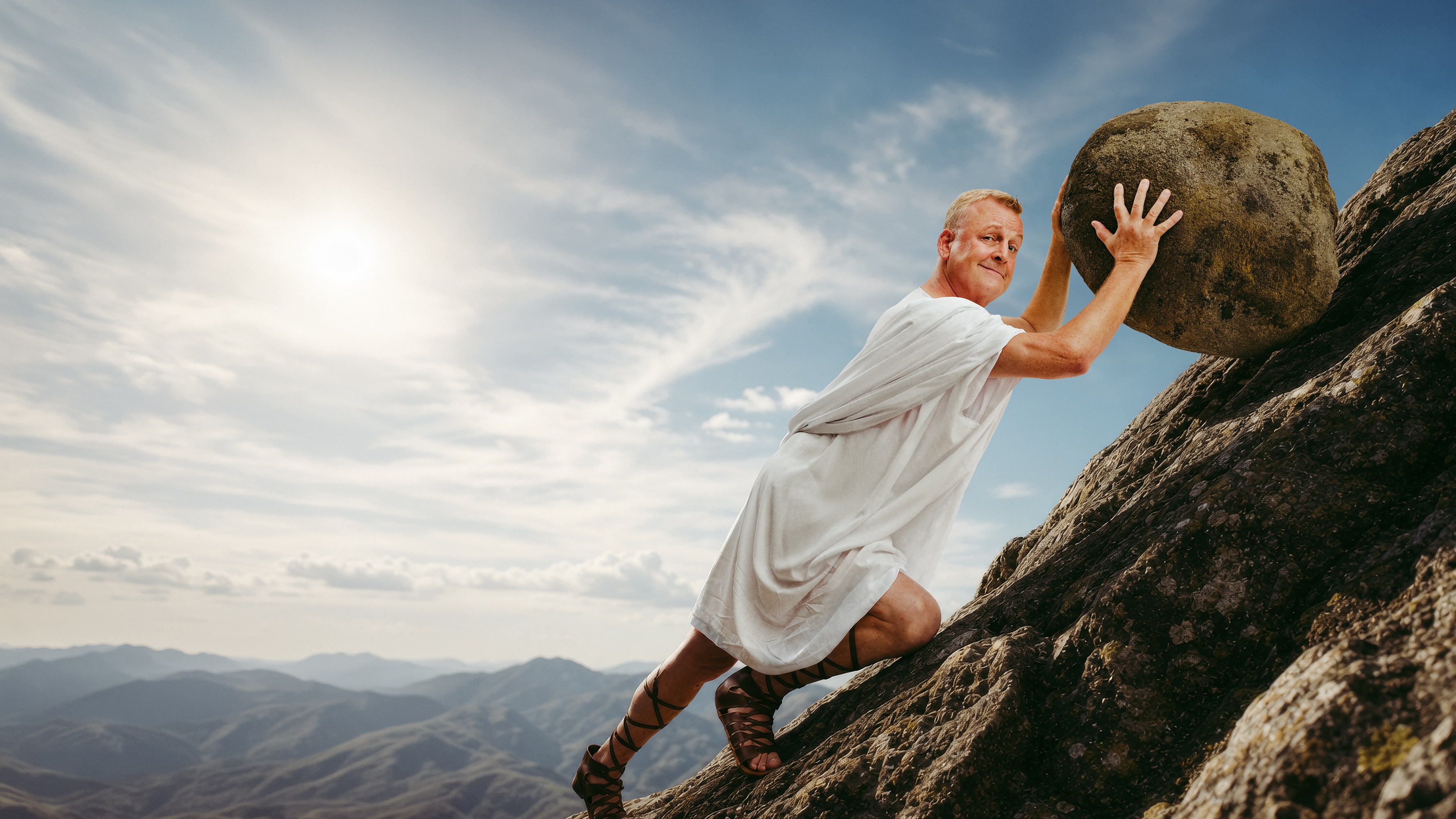Man with a large stone