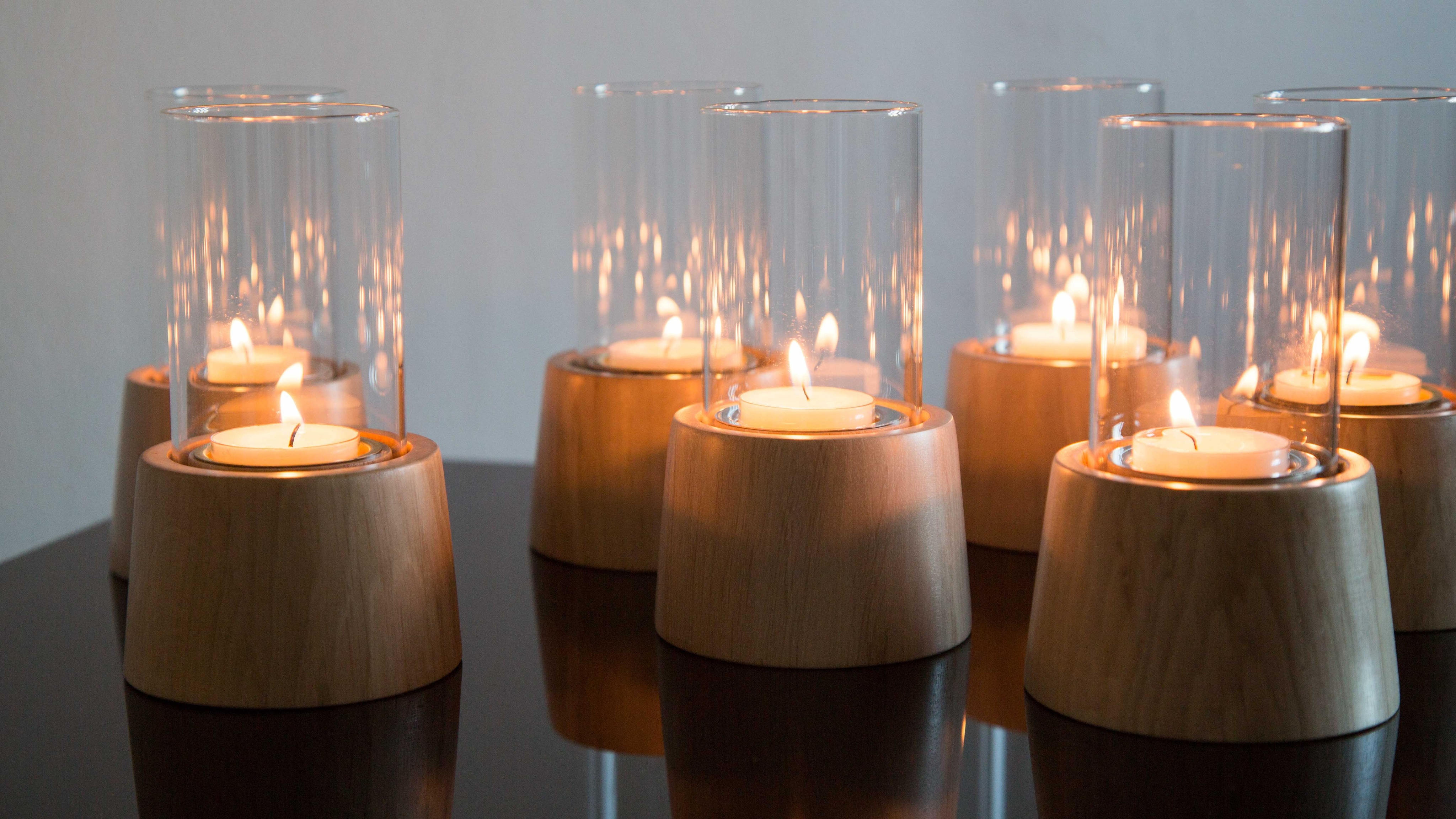Candles in glass and wood