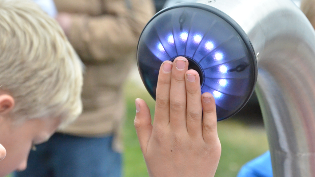Boy making sounds in the sound playground in Esbjerg