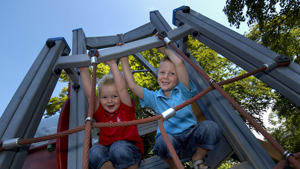 Children climb in play tower