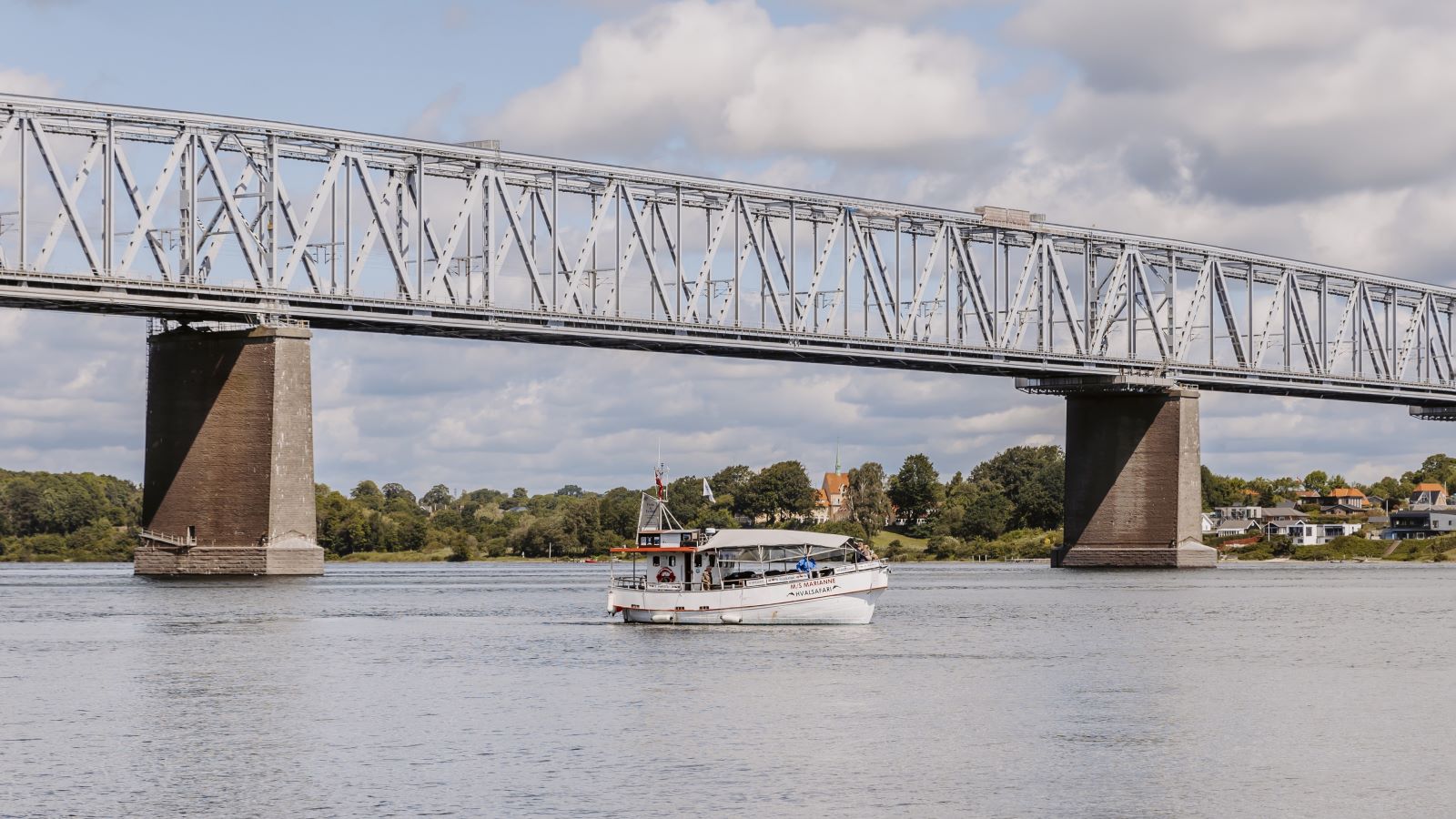 MS Marianne sails on a whale safari under the Old Little Belt Bridge.