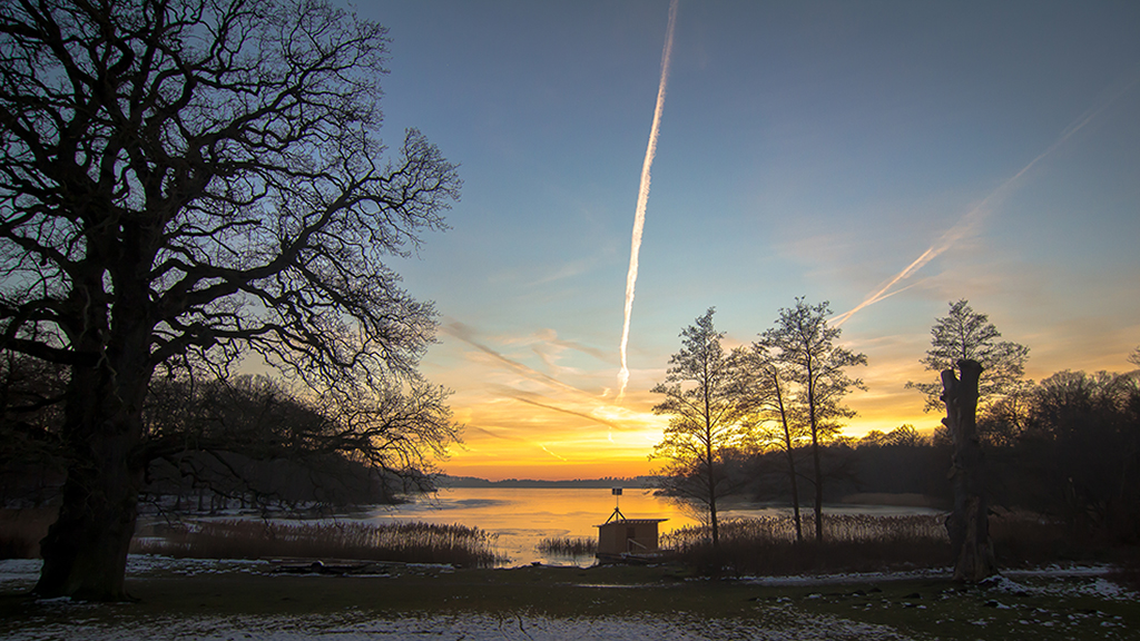 Solnedgang over Skarresø af Mikael Knøfler