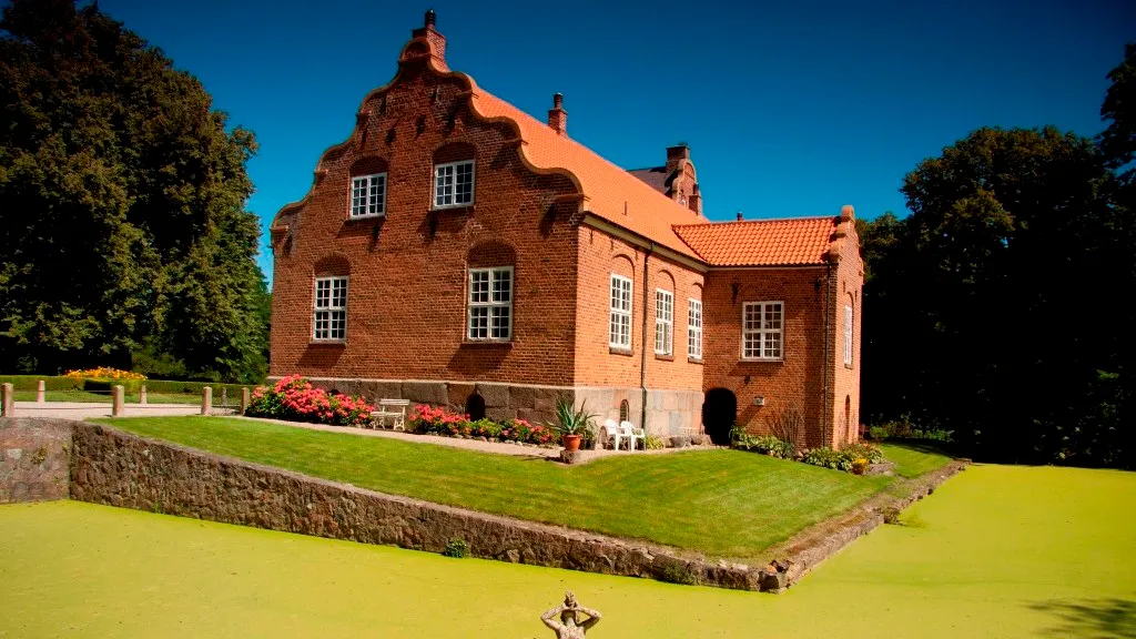 Ulriksholm Castle seen from the side with a beautiful garden.