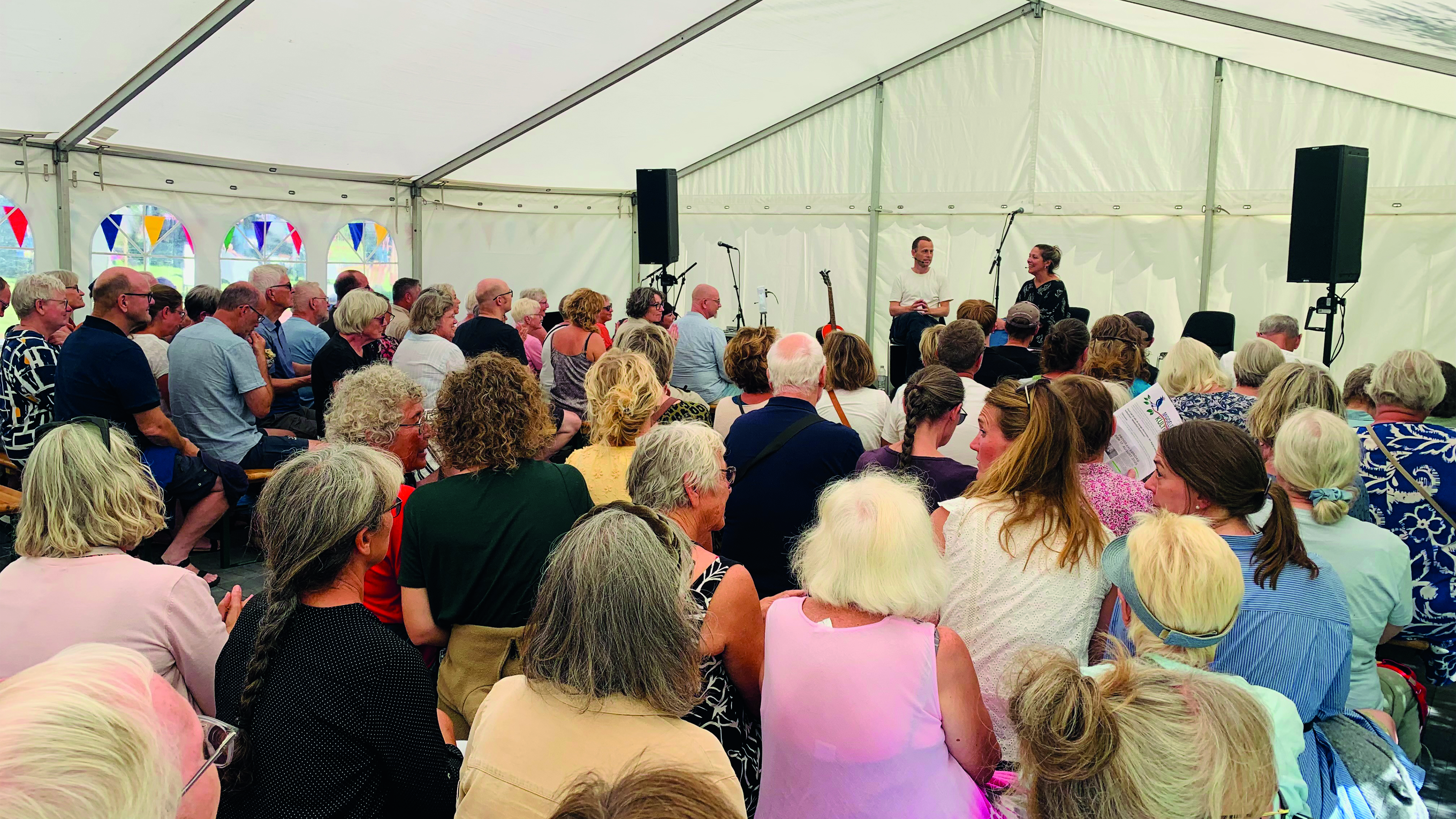 Talk in a white tent