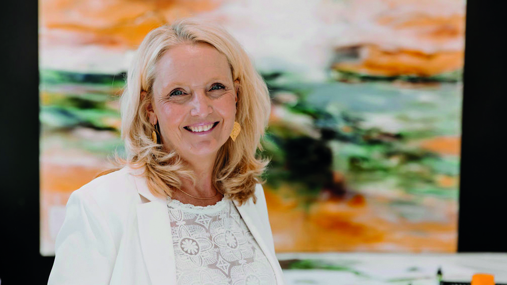 Gitte Ladefoged is seen standing in front of a painting