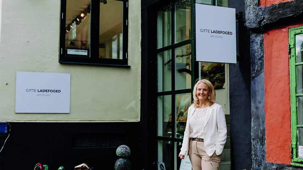 Gitte Ladefoged stands in front of her gallery