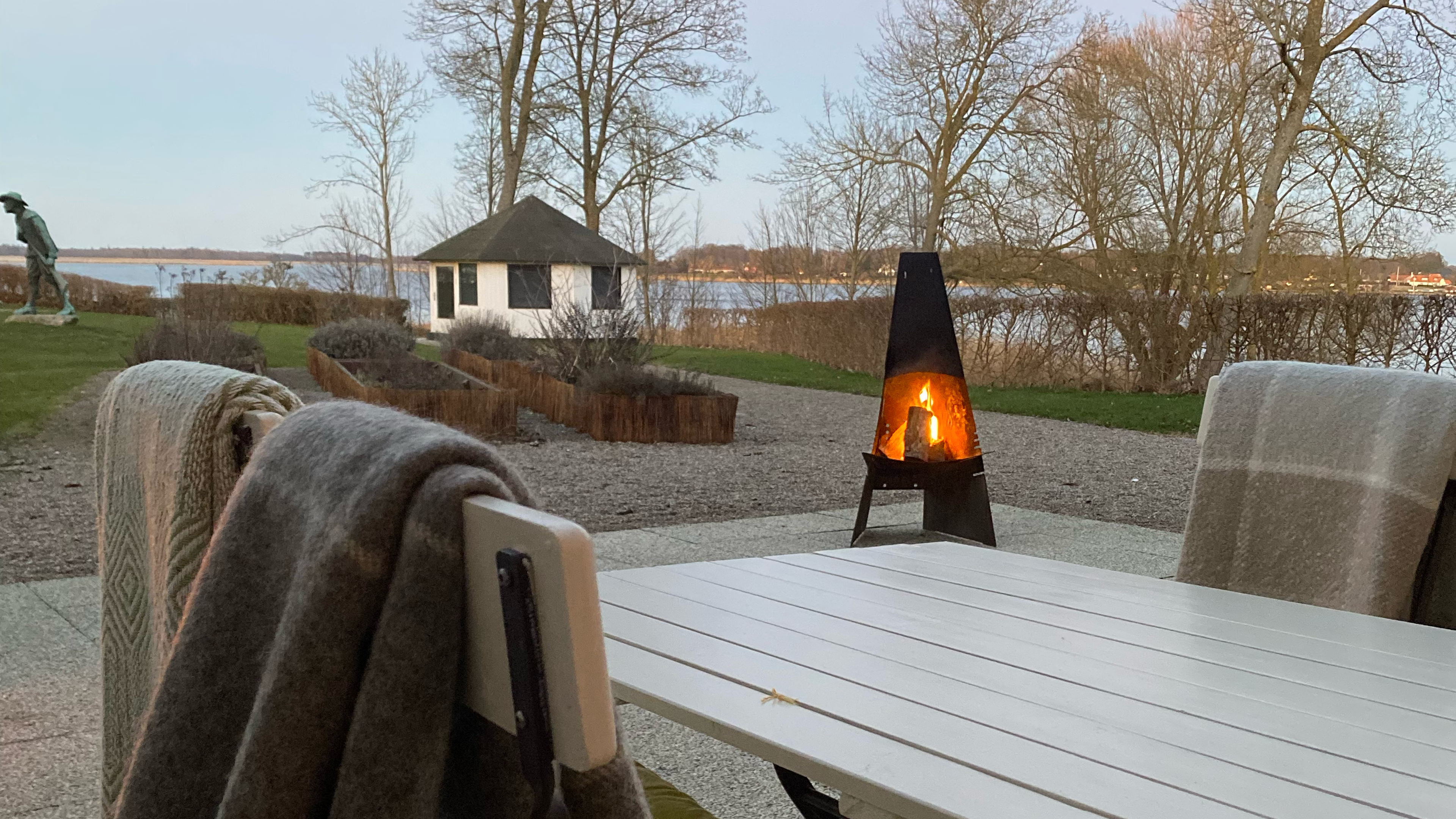 Outdoor seating area with views of the fjord
