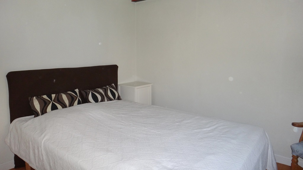 A bedroom at Strandlykken B&B