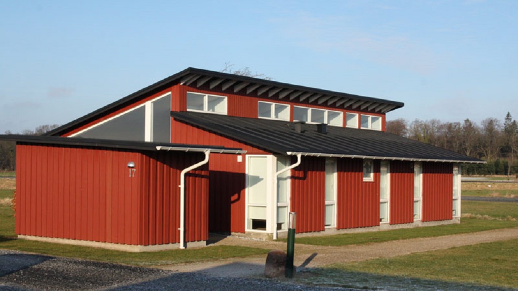 One of the red holiday houses at Bogense Golf Club