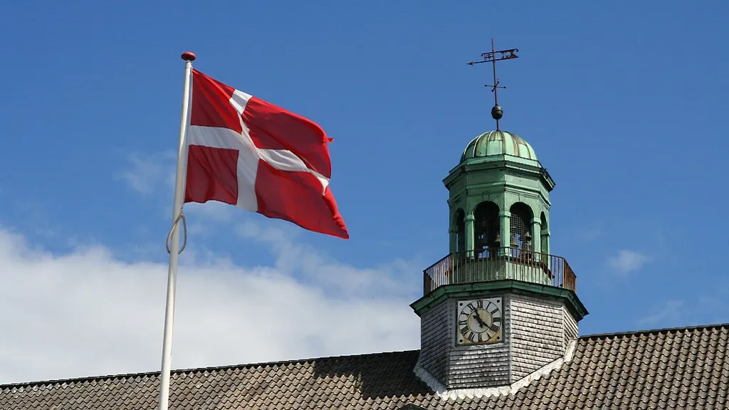 The town hall tower with the carillon - and the flag Dannebrog in front