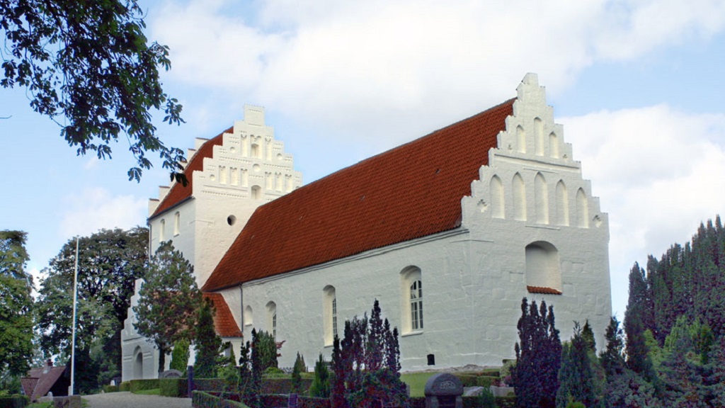 The whitewashed Ore Church and the cemetery