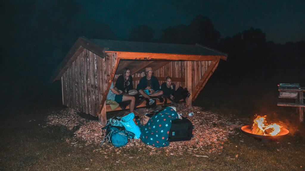 Cozy evening around the fire at the shelter at Ditlevsdal Bisonfarm
