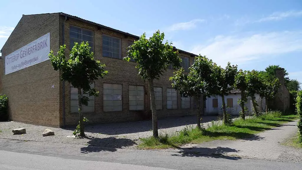 Otterup rifle factory and the trees that grow on the long side of the building