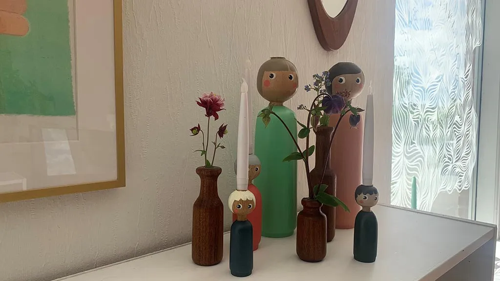 Bottle-shaped wooden vases and various Miss U figures