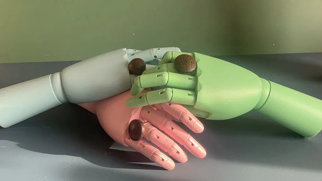 Bendable wooden hands in different colours