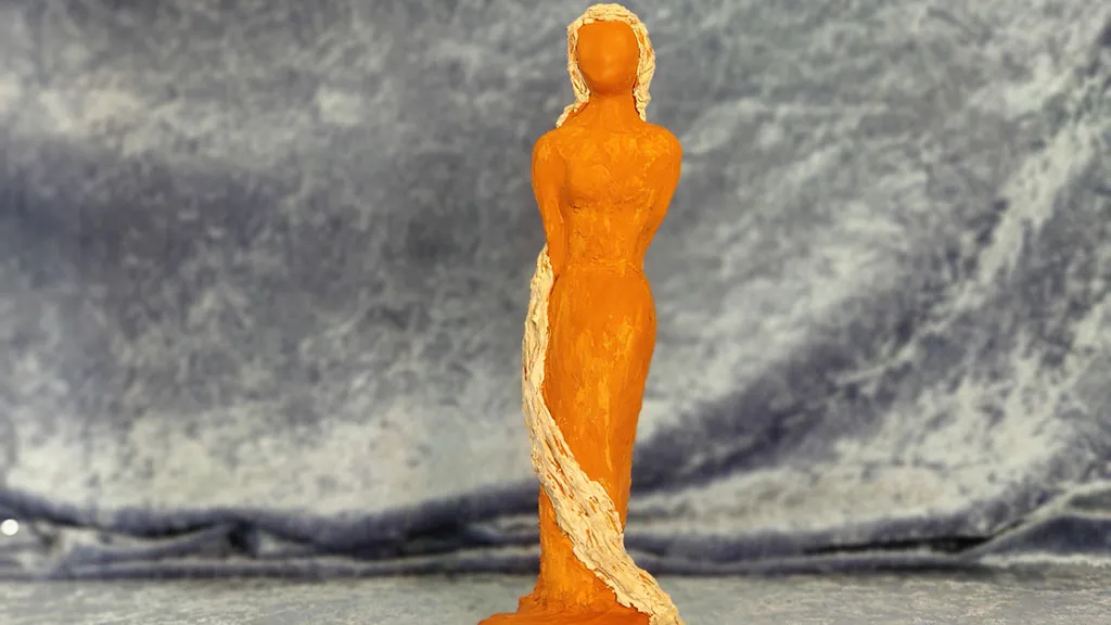 Ceramic female figure with long blond hair