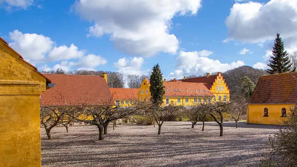 The inner courtyard at Elvedgård with many buildings