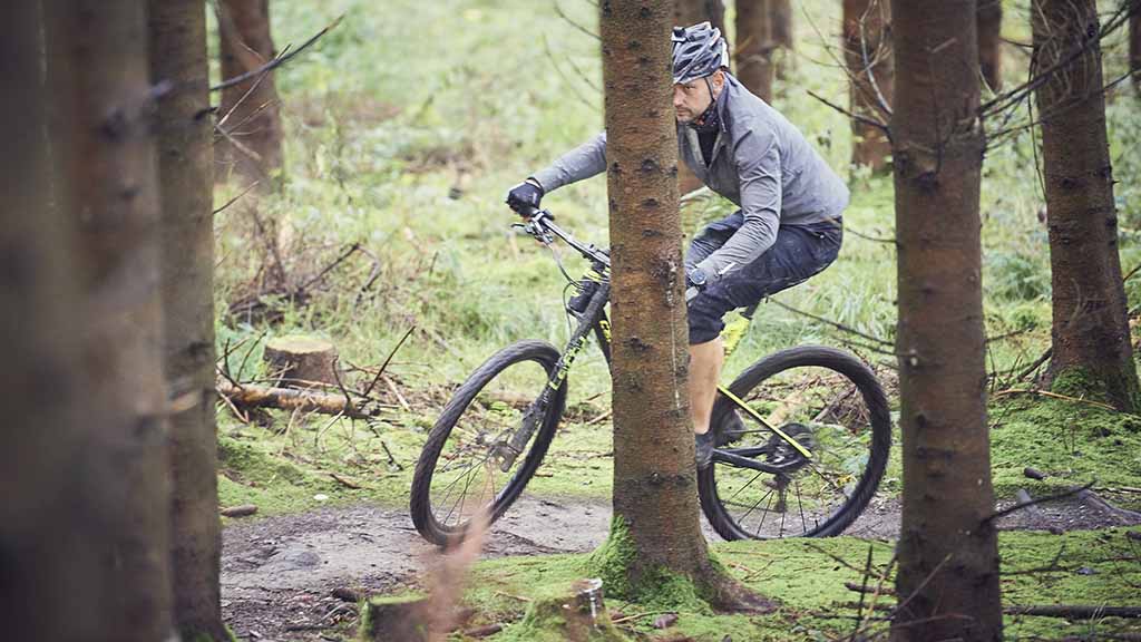 Man cycling on the MTB track in Langesø forest