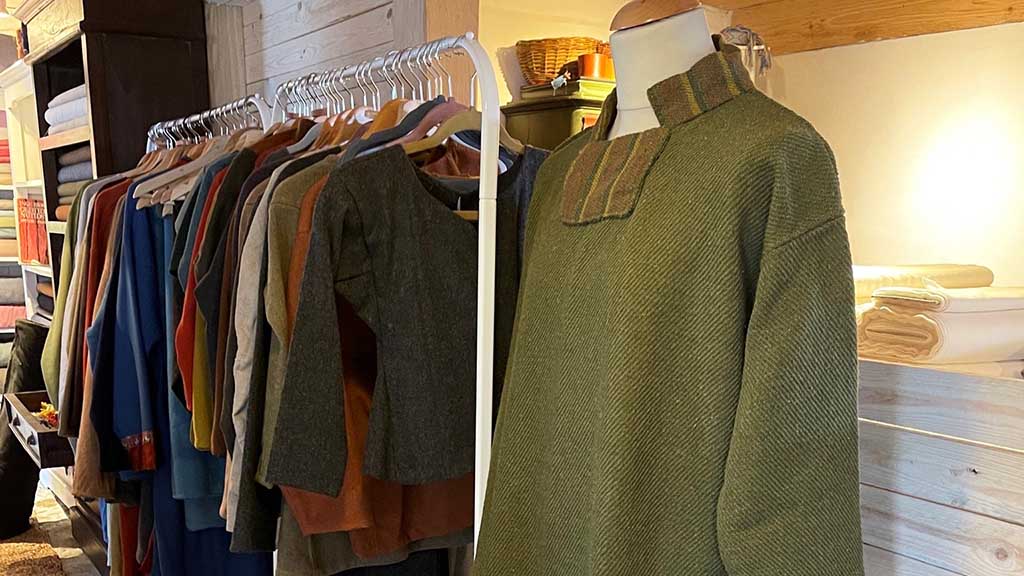 Various Viking costumes hang in a row at Disaheim