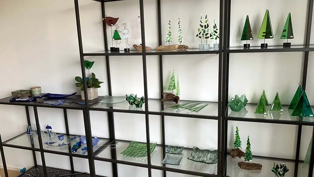 Shelf with different types of glass art