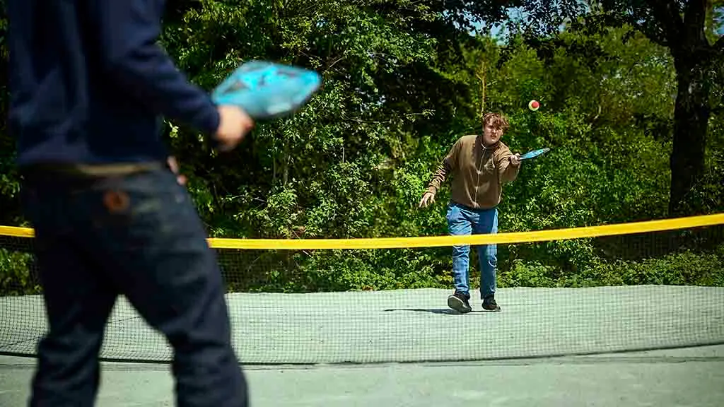 Young people play table tennis in nature in Funen Sommerland