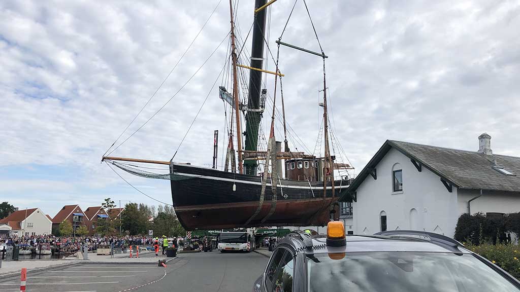 Castor is moved across the road by the large crane