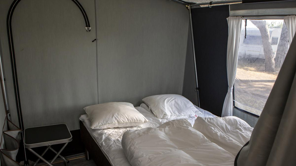 Glamping tent interior at DCU Camping Flyvesandet