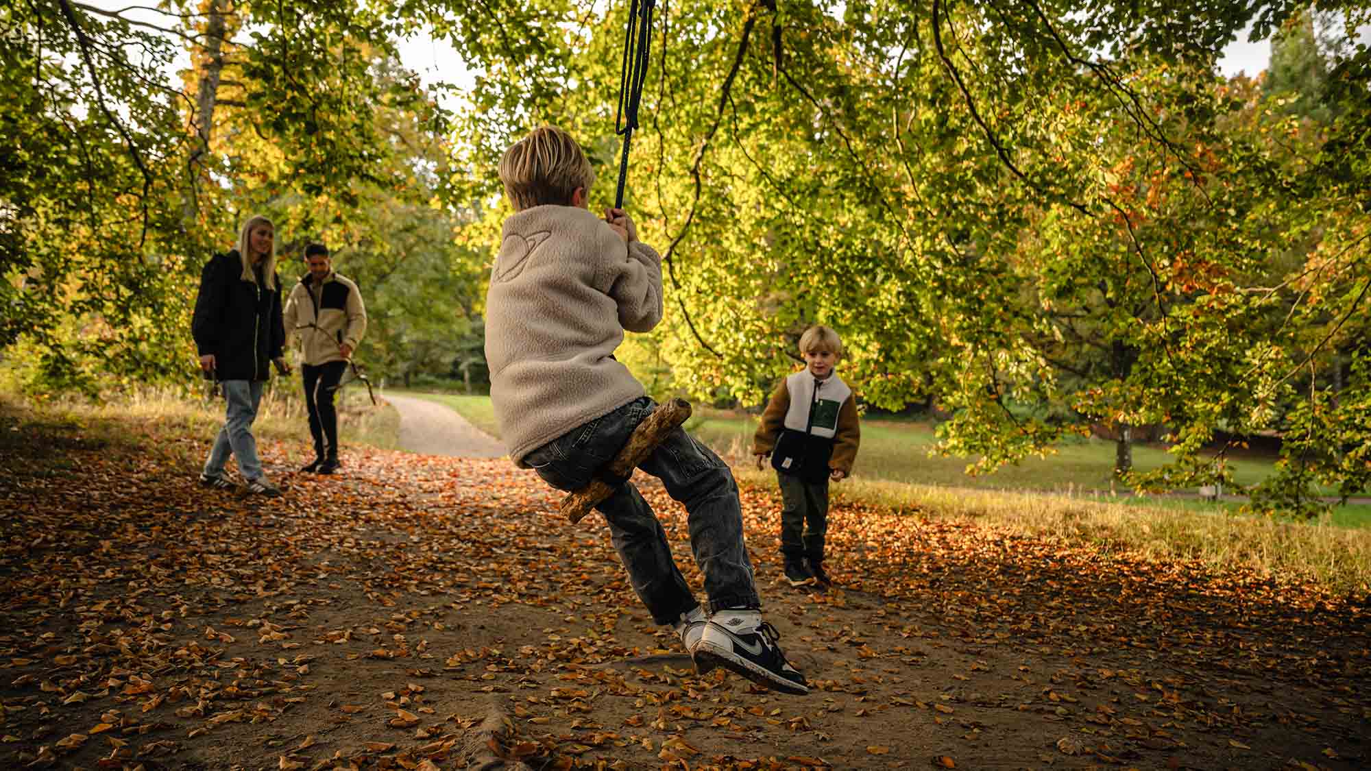 A family out for a walk by Langesø in the autumn