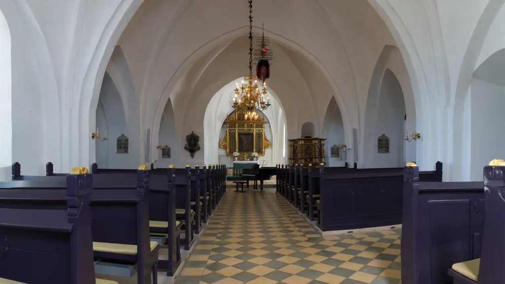 The nave in Bogense Church with a view of the altarpiece
