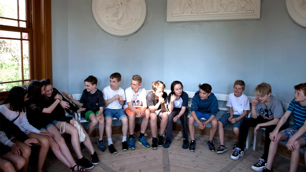 School students gathered in the Pavilion in the Art Museum's garden