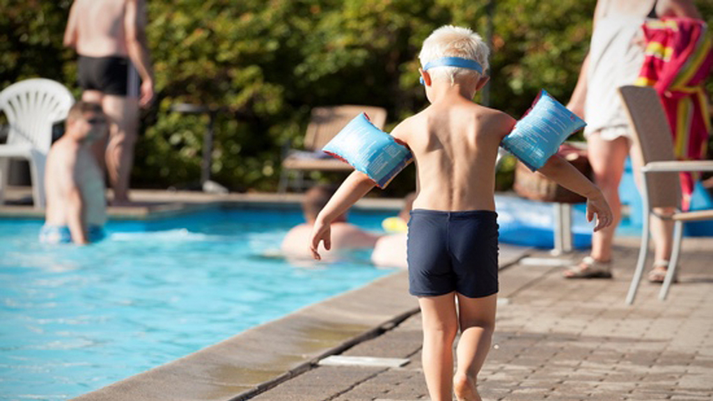 Boy by the pool at Ribe Camping