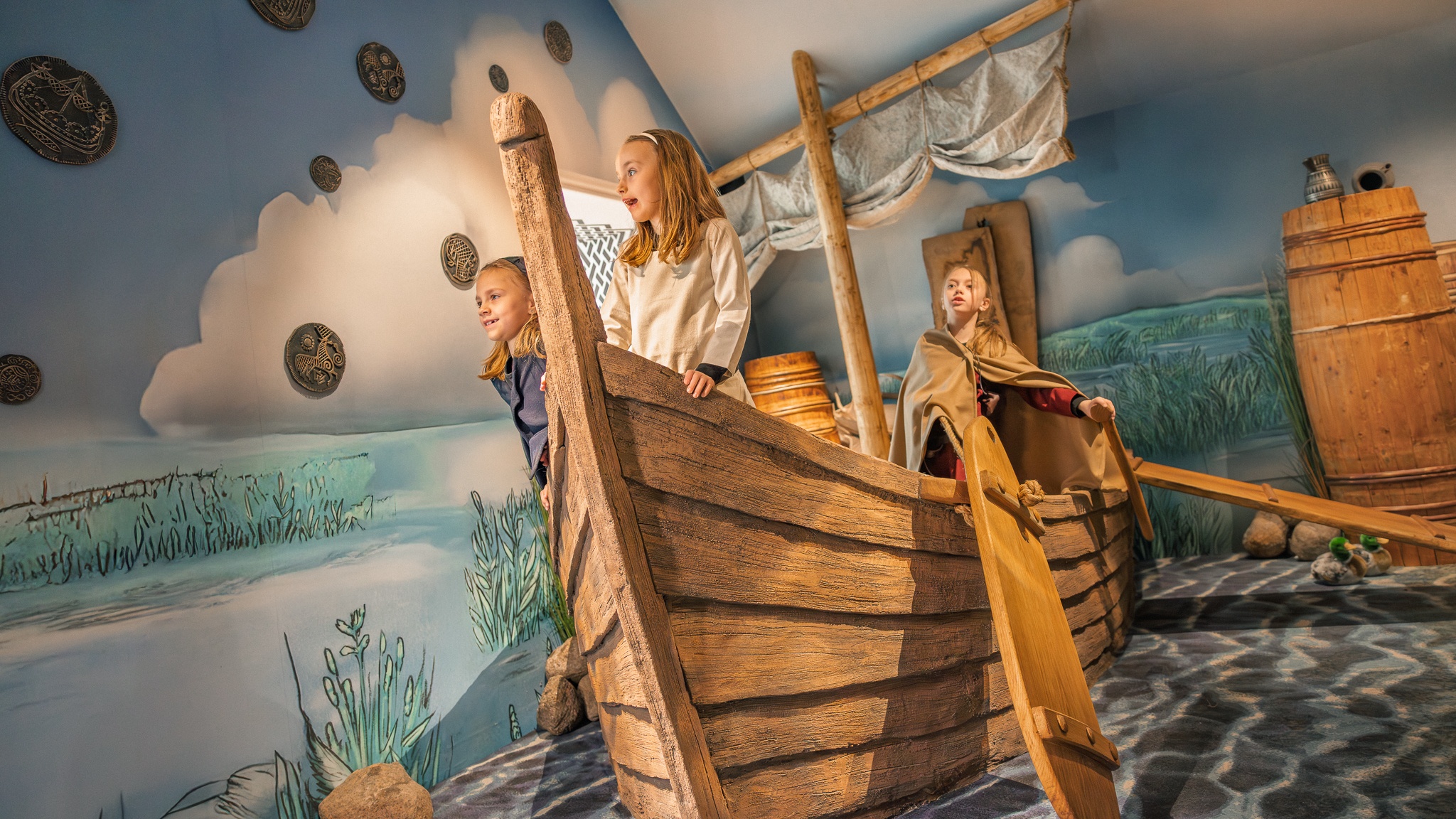 Children in a wooden boat