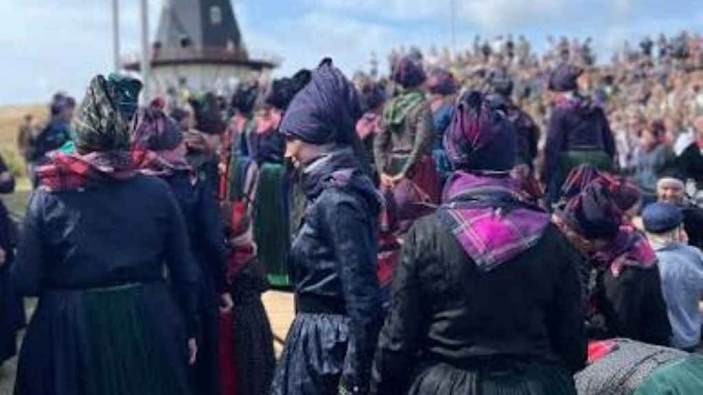 Folk dress by the mill