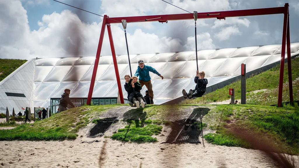 A family on the swings in Naturkraft