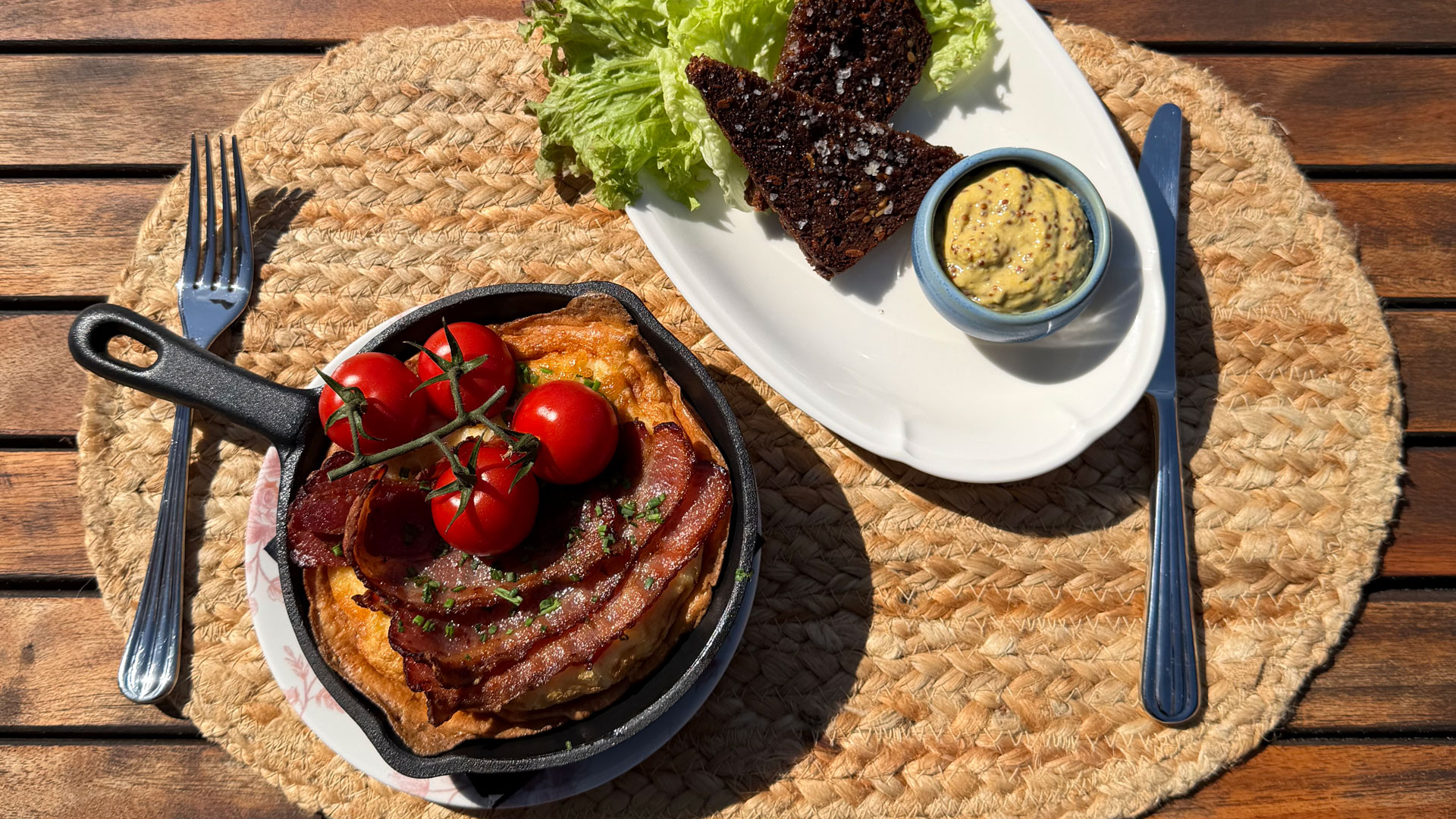 Classic omelette with bacon and tomatoes served on the terrace.