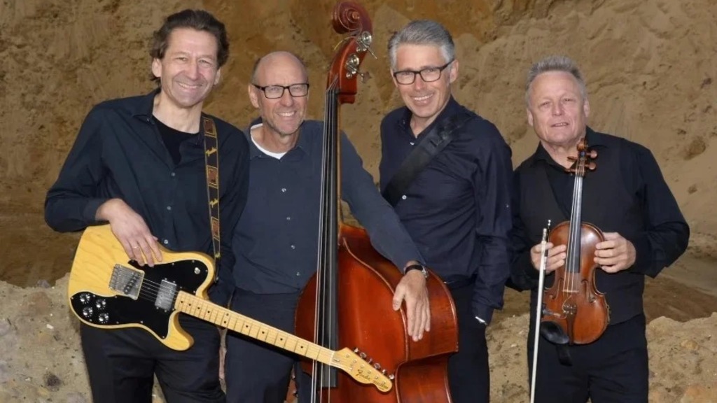 The picture shows four musicians with their various instruments.