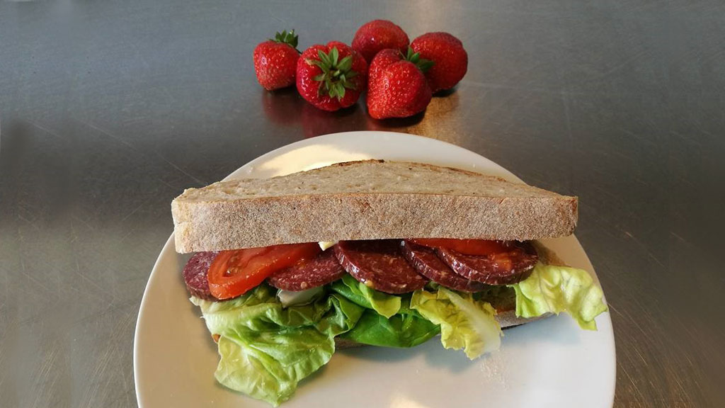 Sandwich with salami on a plate at Café Sdr. Vissing Torvehal