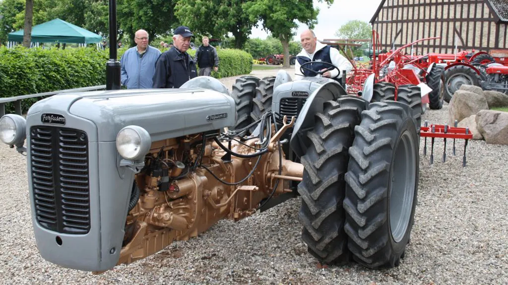 A rare tandem tractor being driven on a field at Denmark's Ferguson Museum