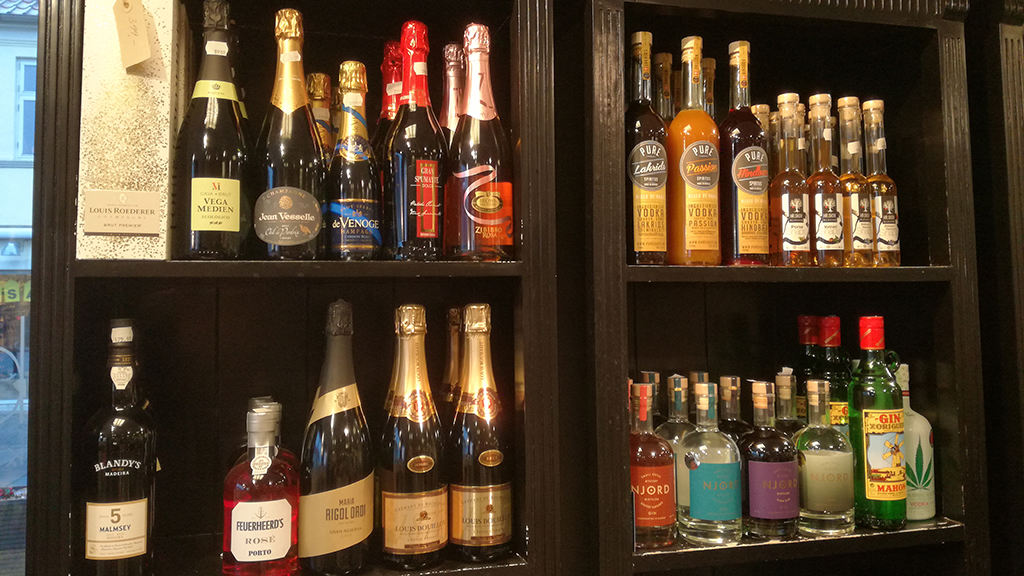 Spirits and wine on the shelves at Blas Kaffe & The in Odder
