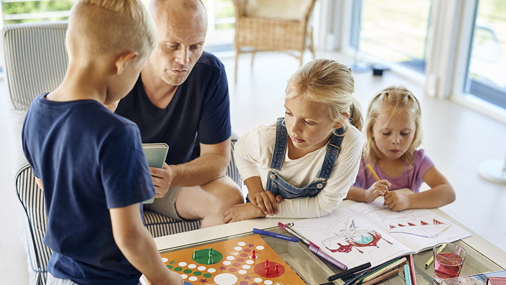 Family enjoying time together in a summer house by the Odder Coast