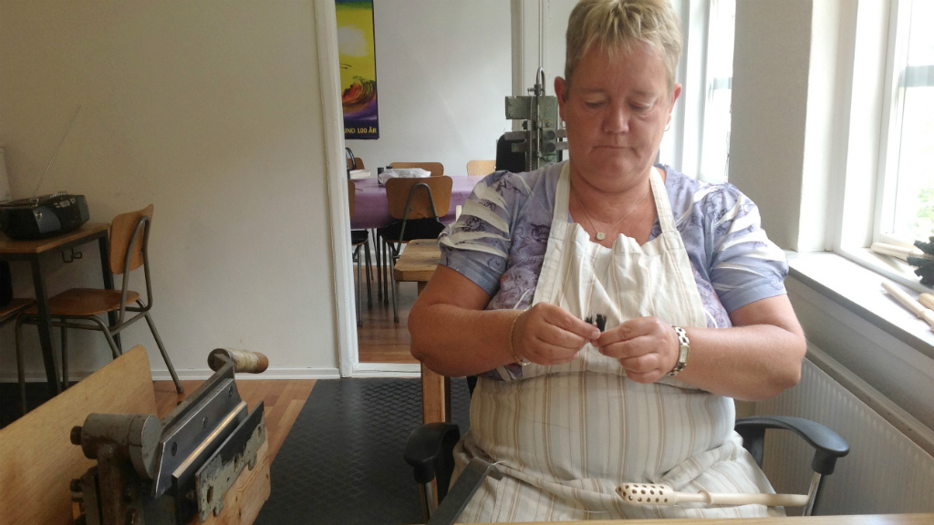 A woman making a brush at Blindes Arbejde in Horsens