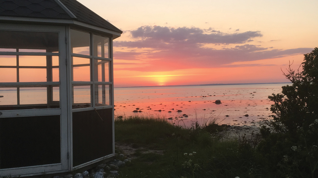 Sunset over the sea viewed from the lookout point at Kærhuset on Endelave
