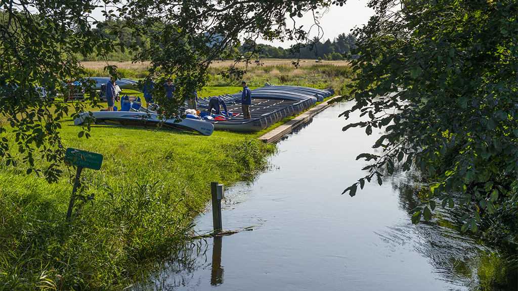 Canoes ready to be launched into the Gudenå River.