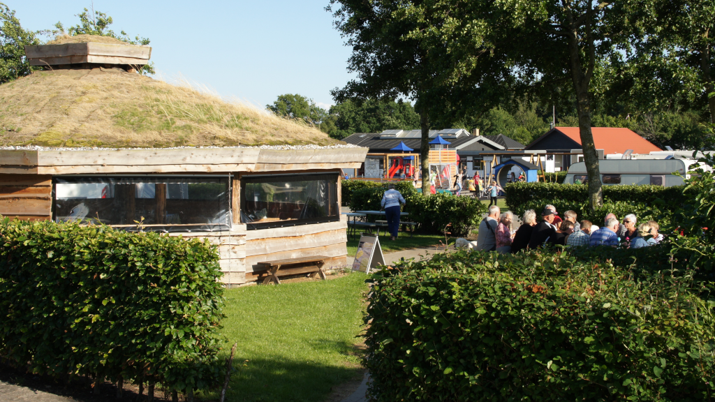A cabin and playground at Hou Strand Camping