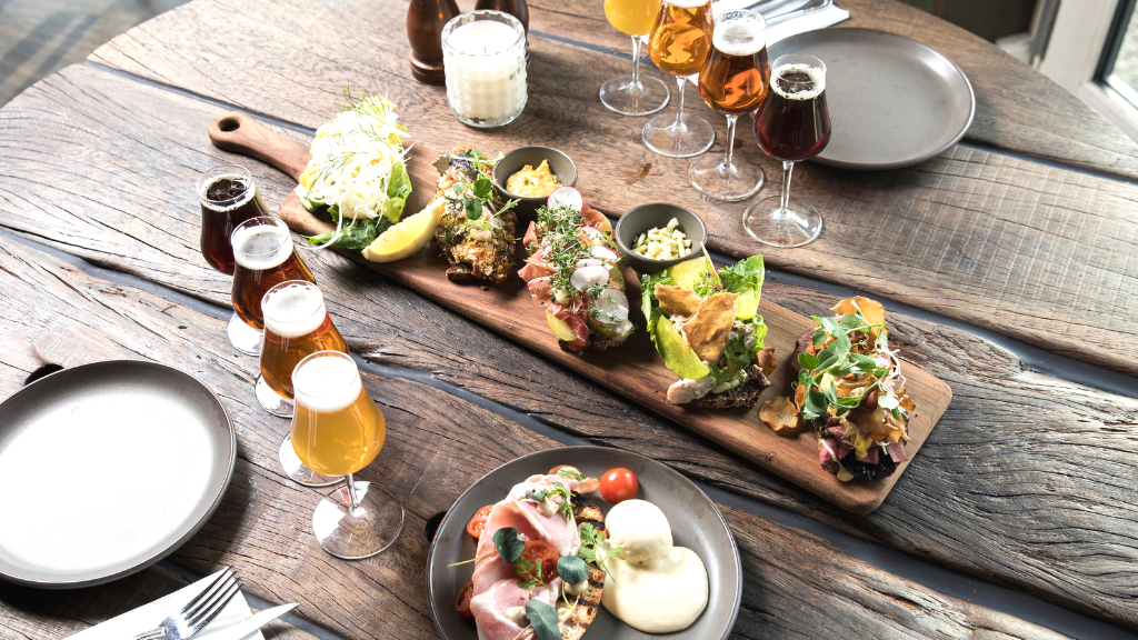 Serving tray with smørrebrød and beer at Café Gran in Horsens