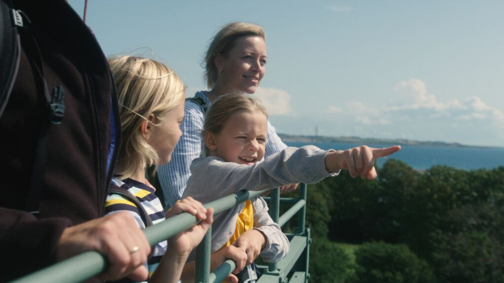A family enjoys the view from the lighthouse on Tunø