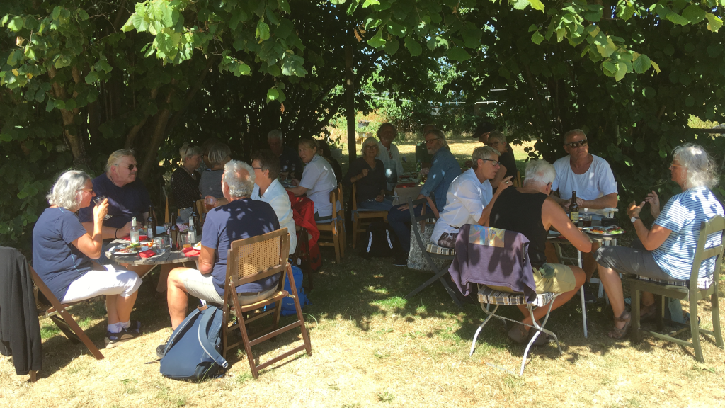 Dining under the shade of trees at Louises Pensionat on Endelave